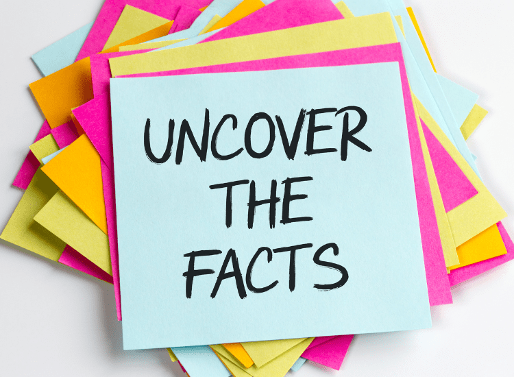 Pile of post-it notes with the top note reading, "Uncover the Facts."