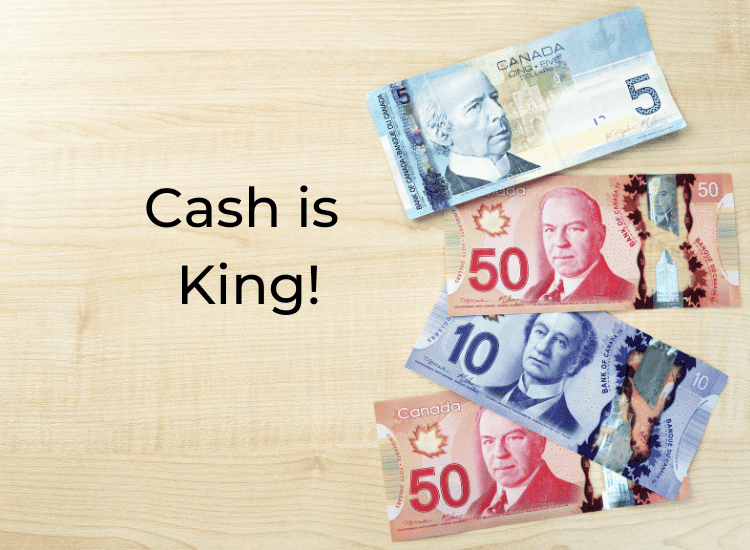 Canadian money lying on a table with the title, "Cash is King!"